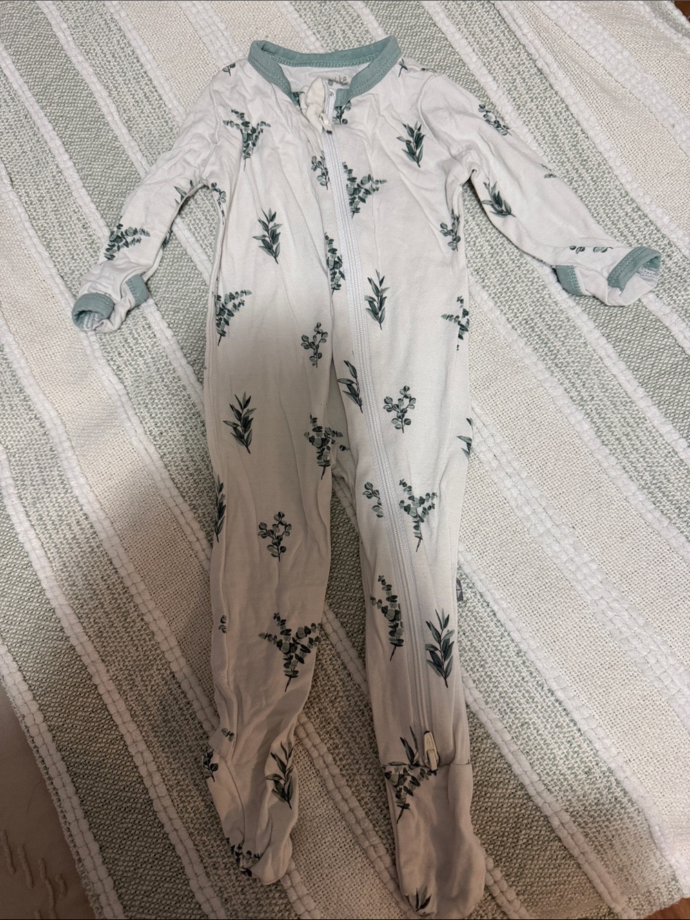 Kyte BABY Cream Footed Jumpsuit with Green Leaf Print